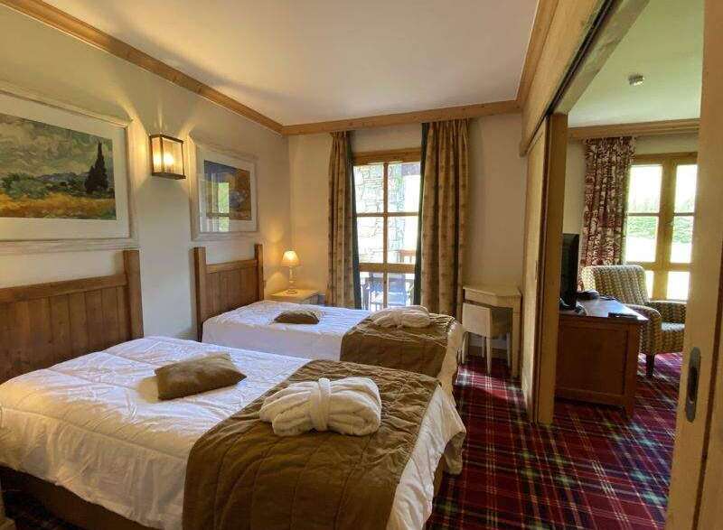 Cozy bedroom with two twin beds, perfect for a comfortable stay.