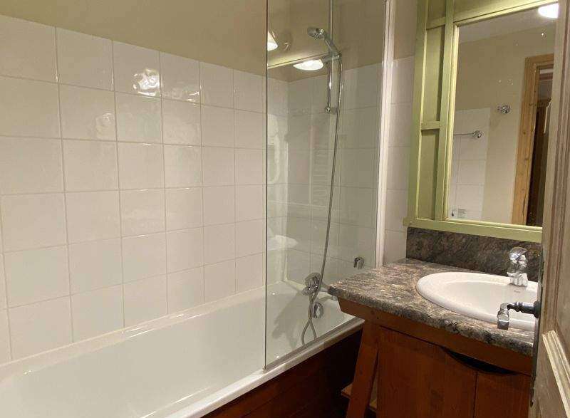 Discover a charming bathroom with a bathtub and shower combination.
