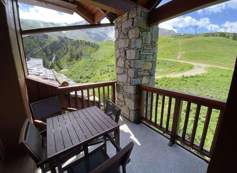 Enjoy breathtaking mountain views from this charming balcony.