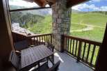 Enjoy breathtaking mountain views from this charming balcony.