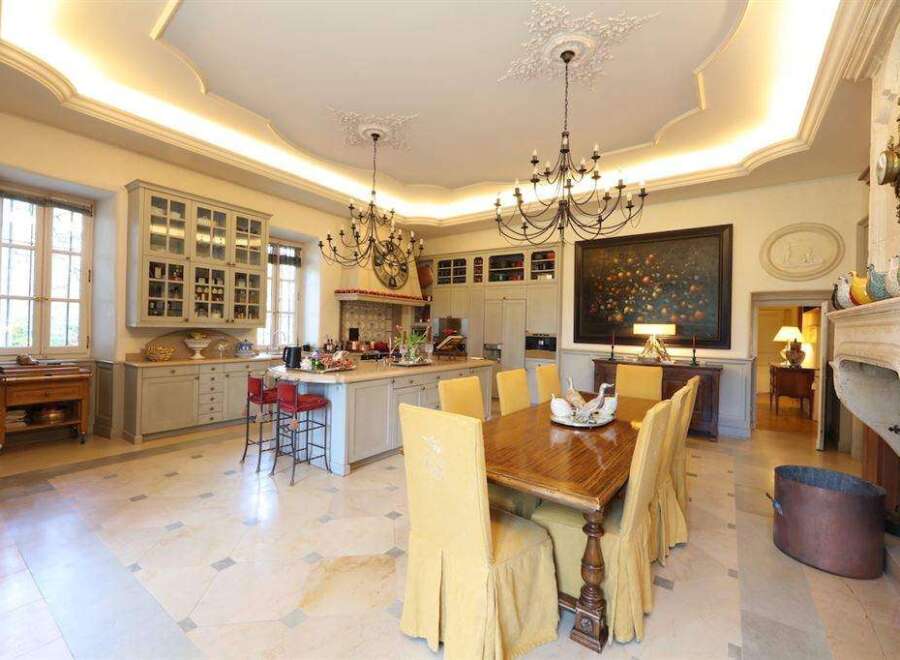 This stunning property boasts a spacious kitchen with high-end finishes and a large island, perfect for entertaining.