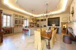 This stunning property boasts a spacious kitchen with high-end finishes and a large island, perfect for entertaining.