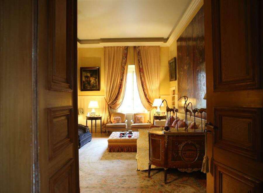 Step into luxury with this stunning property featuring a grand living room.