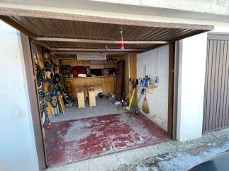 Discover the charm of this well-maintained garage, perfect for storage and hobbies.