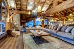 Luxury chalet with stunning mountain views and spacious open-plan living area.
