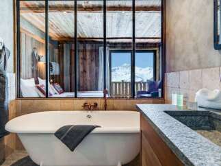 Luxury chalet bathroom with stunning mountain views.