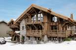 This stunning chalet boasts a unique blend of rustic charm and modern luxury.