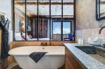 Luxury chalet bathroom with stunning mountain views.