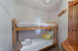 Cozy bunk beds offer a comfortable sleeping arrangement, perfect for families or groups.