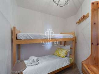 Cozy bunk beds offer a comfortable sleeping arrangement, perfect for families or groups.