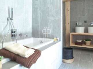 Indulge in the spa-like ambiance of this luxurious bathroom.