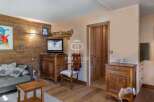 Discover the charm of this cozy property, featuring a warm wooden interior and a welcoming atmosphere.