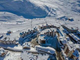 Discover a stunning property nestled in a picturesque snowy landscape.