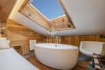 Experience luxury in this stunning property featuring a unique skylight that floods the space with natural light.