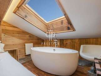 Experience luxury in this stunning property featuring a unique skylight that floods the space with natural light.