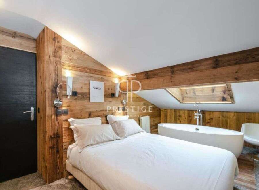 Discover luxury living in this stunning bedroom featuring a unique wooden design.