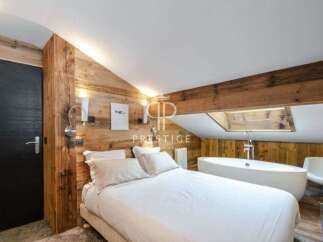 Discover luxury living in this stunning bedroom featuring a unique wooden design.