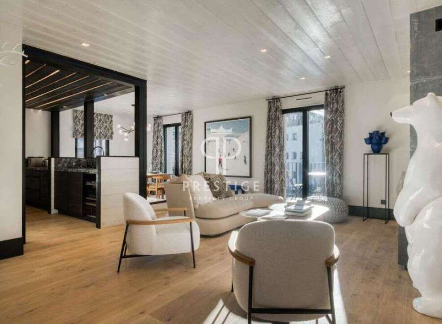 Discover luxury living in this stunning property, featuring a bright and airy living space with beautiful hardwood floors.
