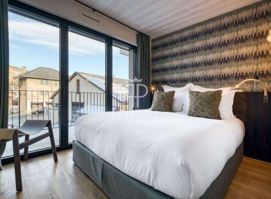 Experience luxury in this stunning bedroom with breathtaking views.