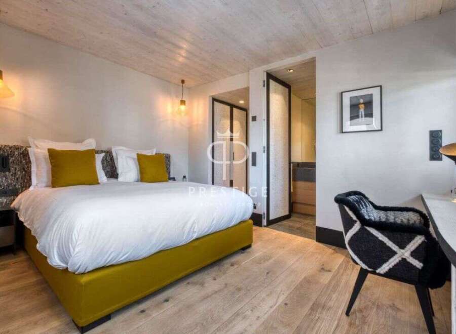 Experience luxury in this stunning bedroom featuring a modern design and elegant decor.