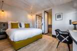 Experience luxury in this stunning bedroom featuring a modern design and elegant decor.
