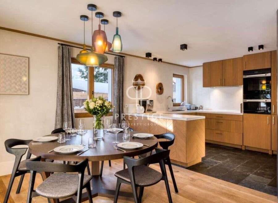Experience luxury living in this stunning property, featuring a modern kitchen with sleek cabinetry and top-of-the-line appliances.