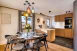 Experience luxury living in this stunning property, featuring a modern kitchen with sleek cabinetry and top-of-the-line appliances.