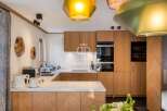 This stunning kitchen boasts custom cabinetry and high-end appliances, perfect for culinary enthusiasts.
