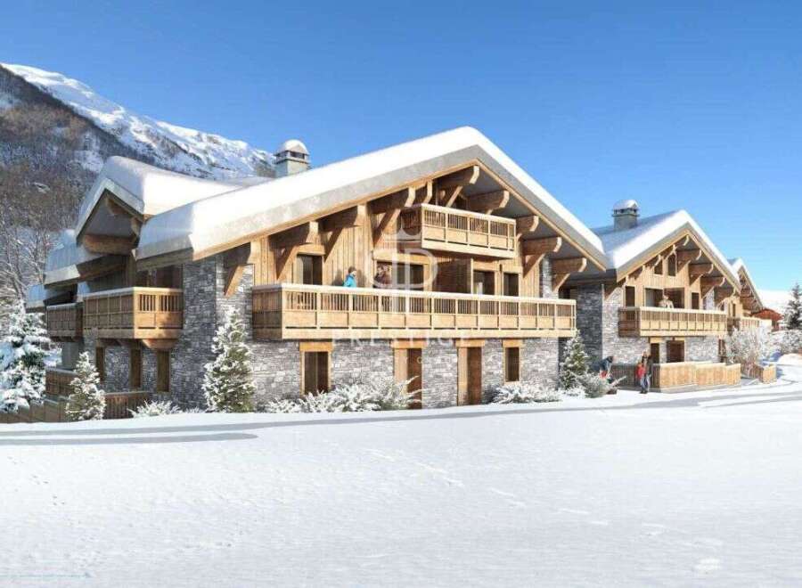 Experience the ultimate winter getaway in these stunning chalets nestled in a snowy landscape.