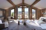 Experience luxury living in this stunning chalet with breathtaking mountain views.