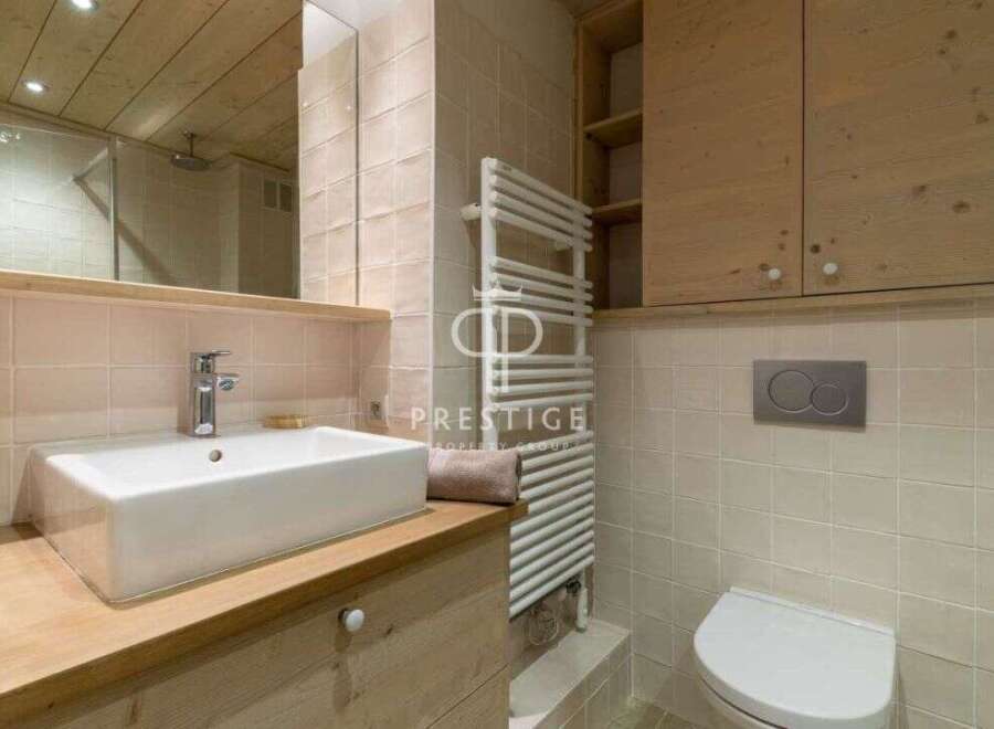 Discover a luxurious bathroom featuring a sleek, modern sink and faucet.