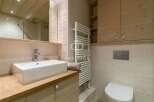 Discover a luxurious bathroom featuring a sleek, modern sink and faucet.