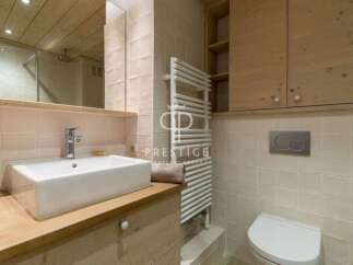 Discover a luxurious bathroom featuring a sleek, modern sink and faucet.