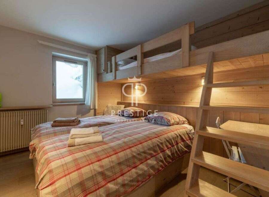 Discover a cozy bedroom with a unique bunk bed setup, perfect for family or group stays.