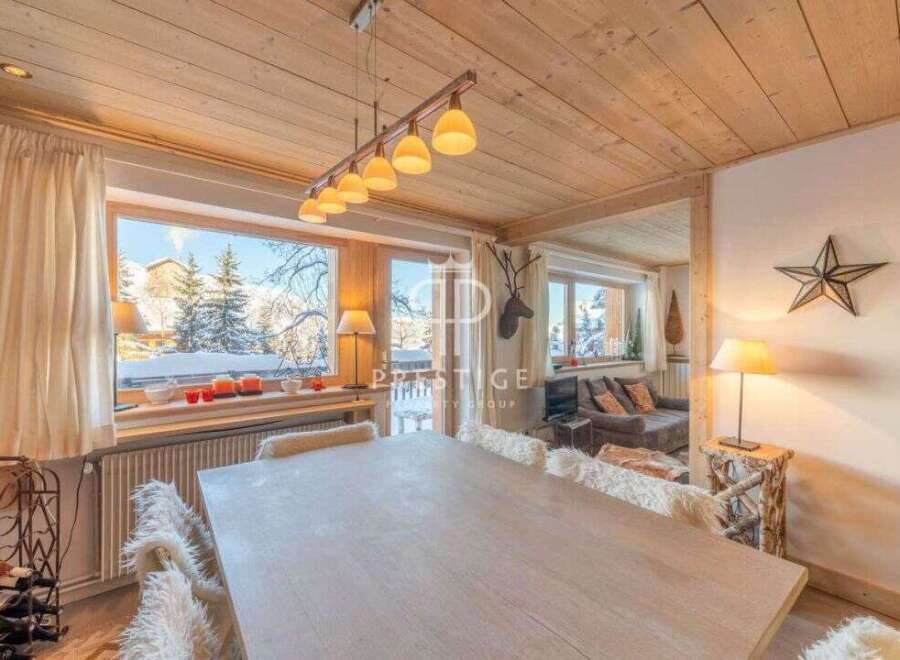 Experience the charm of this cozy chalet, featuring a stunning wooden ceiling and a warm, inviting atmosphere.