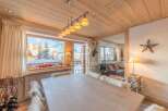 Experience the charm of this cozy chalet, featuring a stunning wooden ceiling and a warm, inviting atmosphere.