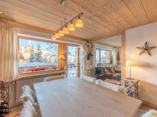 Experience the charm of this cozy chalet, featuring a stunning wooden ceiling and a warm, inviting atmosphere.
