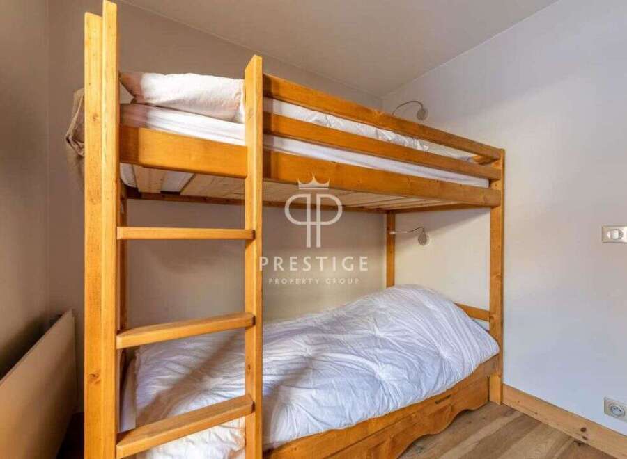 Cozy bunk beds offer a comfortable sleeping arrangement, perfect for families or groups.