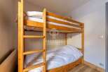 Cozy bunk beds offer a comfortable sleeping arrangement, perfect for families or groups.