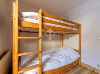 Cozy bunk beds offer a comfortable sleeping arrangement, perfect for families or groups.
