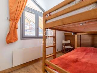 Discover a cozy bedroom featuring a charming bunk bed, perfect for accommodating guests or family.