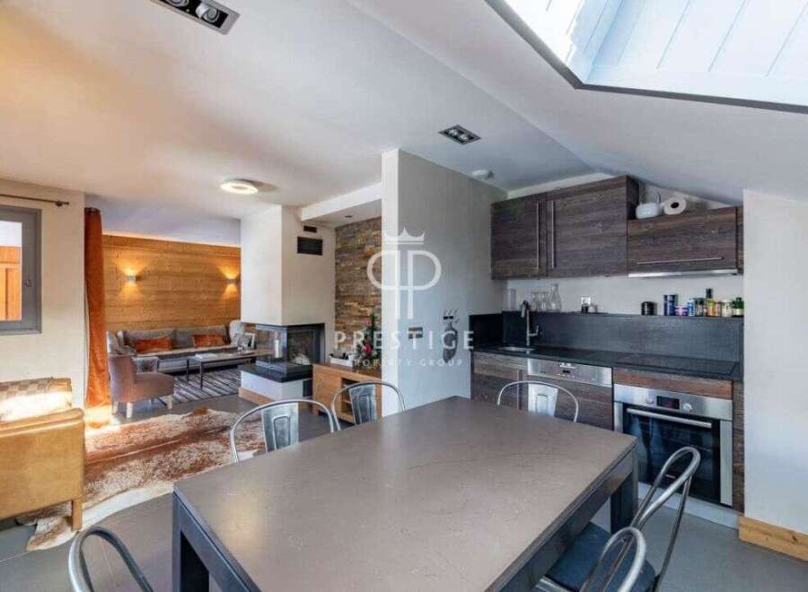 Discover a stunning property featuring a modern kitchen with sleek cabinetry and stainless steel appliances.
