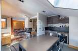 Discover a stunning property featuring a modern kitchen with sleek cabinetry and stainless steel appliances.