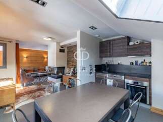 Discover a stunning property featuring a modern kitchen with sleek cabinetry and stainless steel appliances.