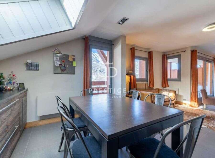 Discover a stunning property with a modern dining area, perfect for entertaining.