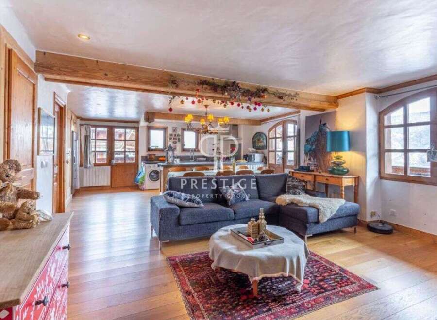 Discover the charm of this stunning property, featuring a spacious open-plan living area with exposed wooden beams.