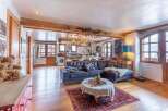 Discover the charm of this stunning property, featuring a spacious open-plan living area with exposed wooden beams.