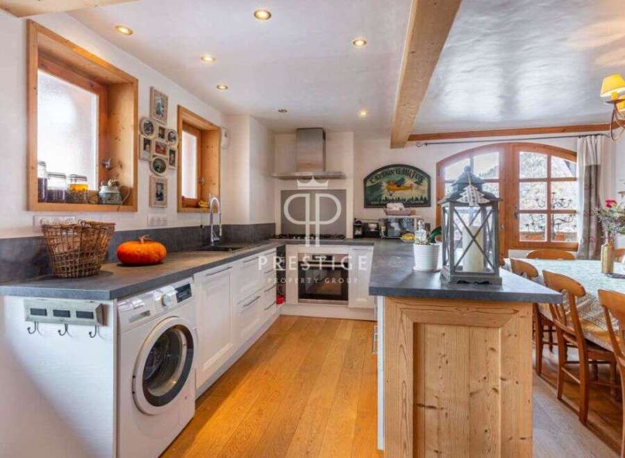 Discover the charm of this stunning kitchen, featuring a modern design with a touch of rustic elegance.