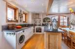 Discover the charm of this stunning kitchen, featuring a modern design with a touch of rustic elegance.