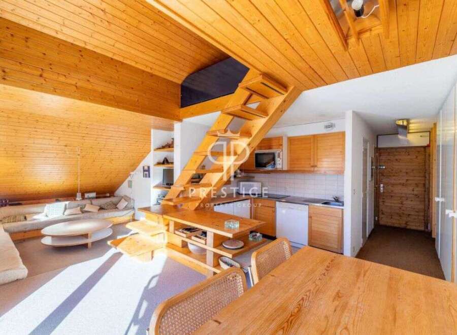 Discover a cozy and inviting living space with a unique wooden design.